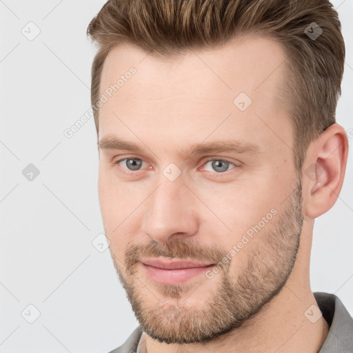 Joyful white adult male with short  brown hair and grey eyes