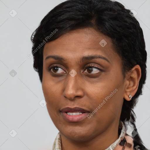 Joyful black adult female with short  brown hair and brown eyes