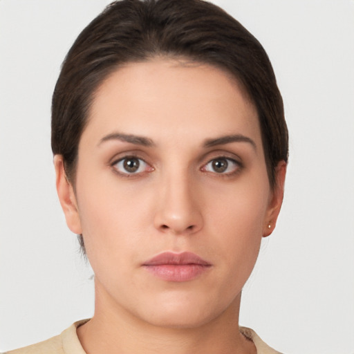 Neutral white young-adult female with short  brown hair and brown eyes