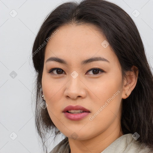 Joyful asian young-adult female with long  brown hair and brown eyes