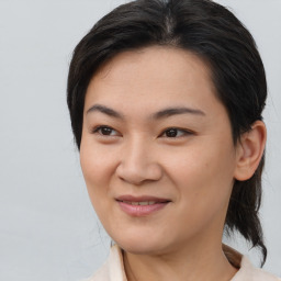 Joyful asian young-adult female with medium  brown hair and brown eyes