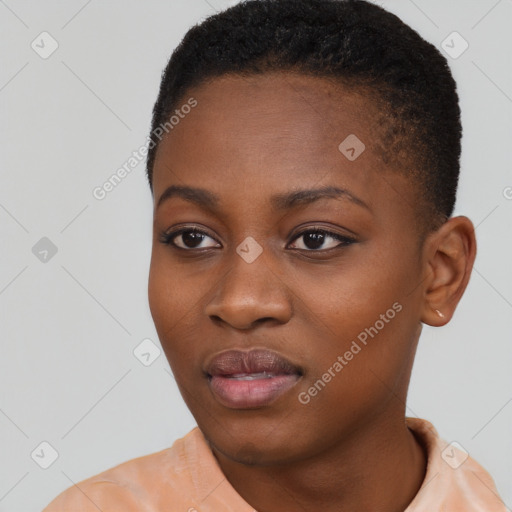 Joyful black young-adult female with short  brown hair and brown eyes