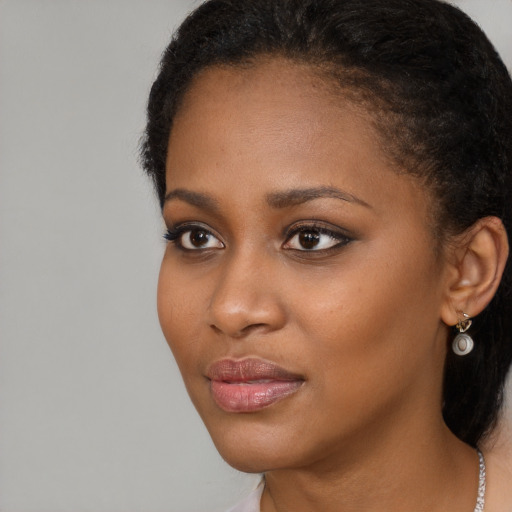 Neutral black young-adult female with long  brown hair and brown eyes