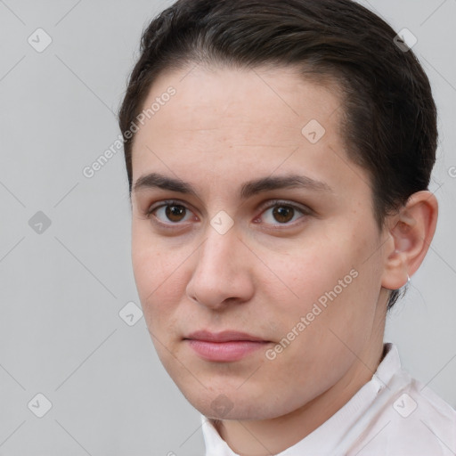 Joyful white young-adult female with short  brown hair and brown eyes