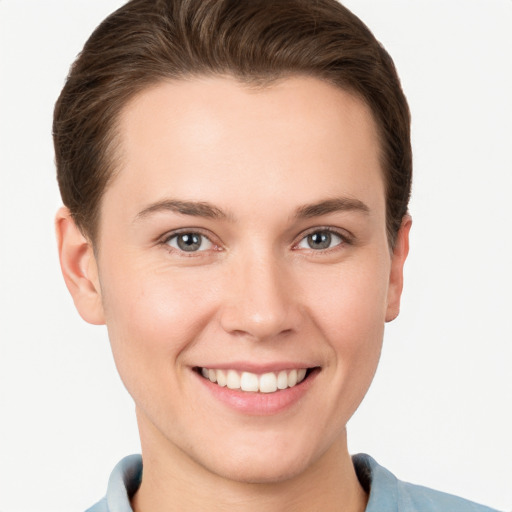 Joyful white young-adult female with short  brown hair and grey eyes