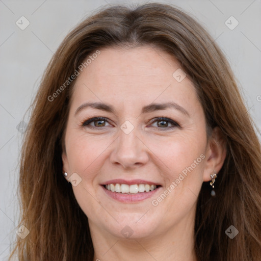 Joyful white adult female with long  brown hair and brown eyes