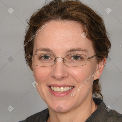 Joyful white adult female with medium  brown hair and blue eyes