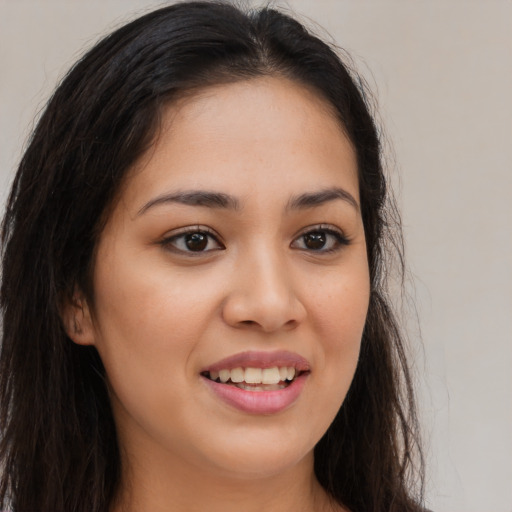 Joyful white young-adult female with long  brown hair and brown eyes