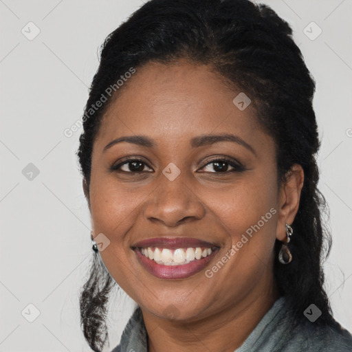 Joyful black young-adult female with long  black hair and brown eyes