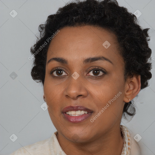 Joyful black young-adult female with short  brown hair and brown eyes