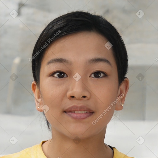 Joyful asian young-adult female with short  black hair and brown eyes