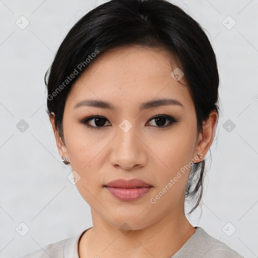 Joyful asian young-adult female with medium  black hair and brown eyes