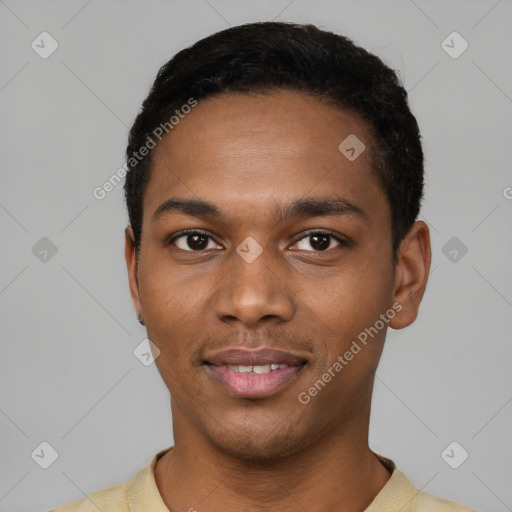 Joyful black young-adult male with short  black hair and brown eyes