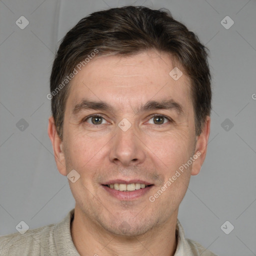 Joyful white adult male with short  brown hair and grey eyes