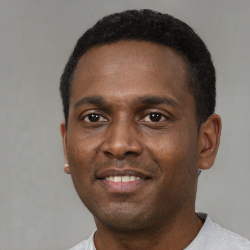 Neutral black young-adult male with short  black hair and brown eyes