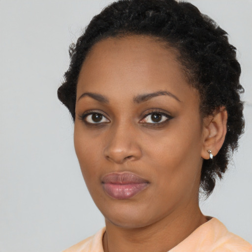 Neutral black young-adult female with short  black hair and brown eyes