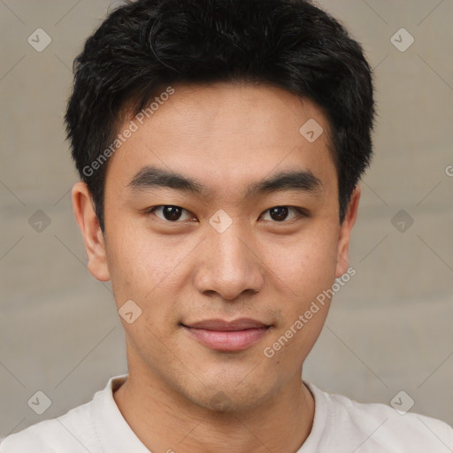 Joyful asian young-adult male with short  black hair and brown eyes