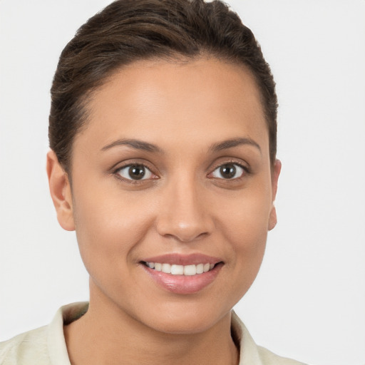 Joyful white young-adult female with short  brown hair and brown eyes