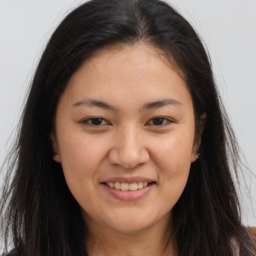 Joyful white young-adult female with long  brown hair and brown eyes
