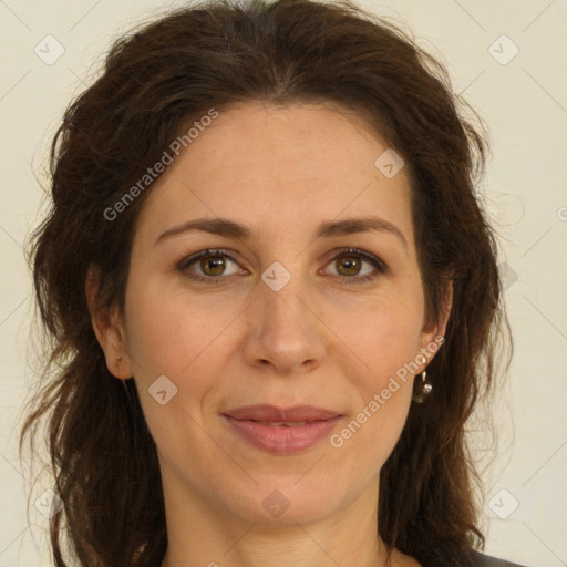 Joyful white adult female with long  brown hair and brown eyes