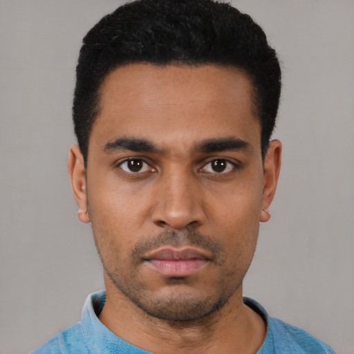 Neutral latino young-adult male with short  black hair and brown eyes