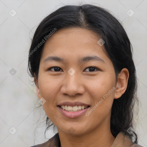 Joyful asian young-adult female with medium  brown hair and brown eyes