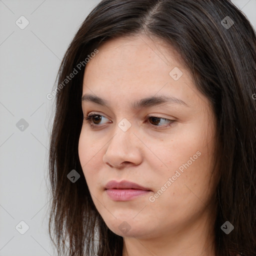 Joyful asian young-adult female with long  brown hair and brown eyes