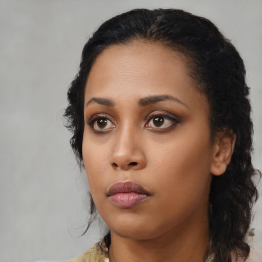 Neutral black young-adult female with medium  black hair and brown eyes
