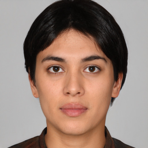 Neutral white young-adult female with short  black hair and brown eyes