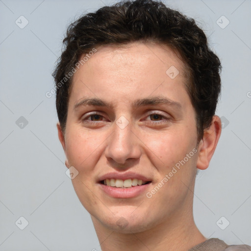 Joyful white young-adult female with short  brown hair and grey eyes