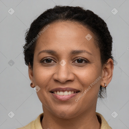 Joyful latino adult female with short  brown hair and brown eyes