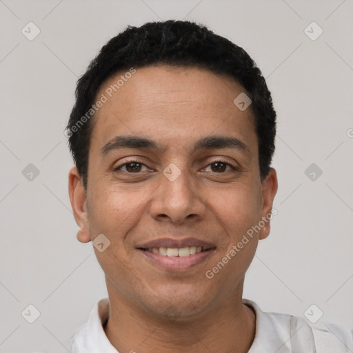 Joyful latino young-adult male with short  black hair and brown eyes