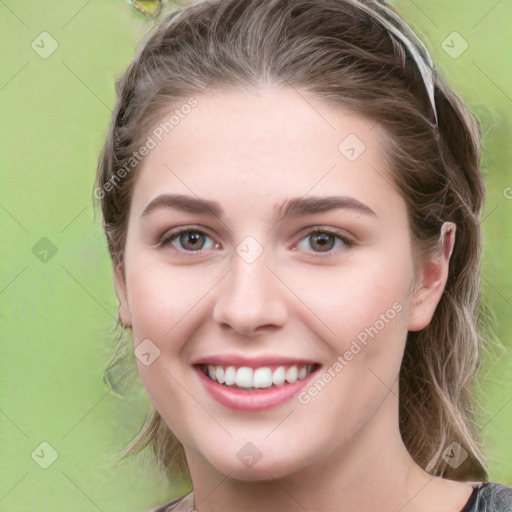 Joyful white young-adult female with medium  brown hair and green eyes