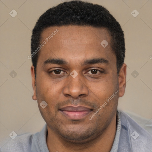 Joyful black young-adult male with short  black hair and brown eyes