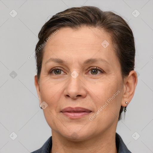 Joyful white adult female with short  brown hair and brown eyes