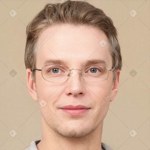 Joyful white adult male with short  brown hair and grey eyes