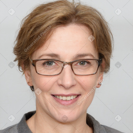 Joyful white adult female with medium  brown hair and blue eyes