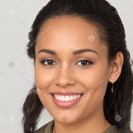 Joyful latino young-adult female with long  brown hair and brown eyes