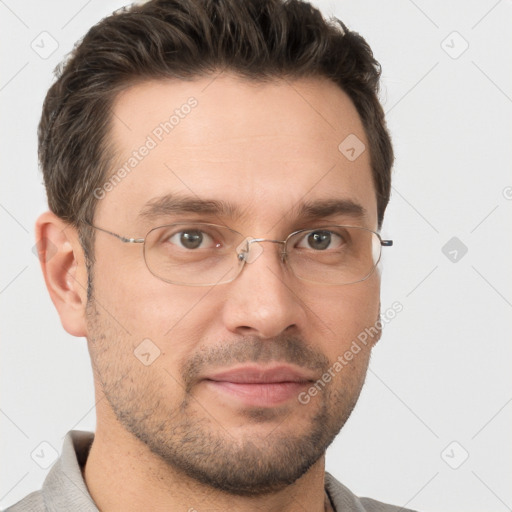 Joyful white adult male with short  brown hair and brown eyes