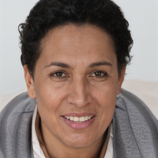 Joyful white adult female with short  brown hair and brown eyes