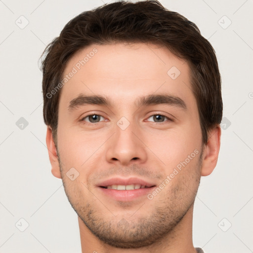 Joyful white young-adult male with short  brown hair and brown eyes