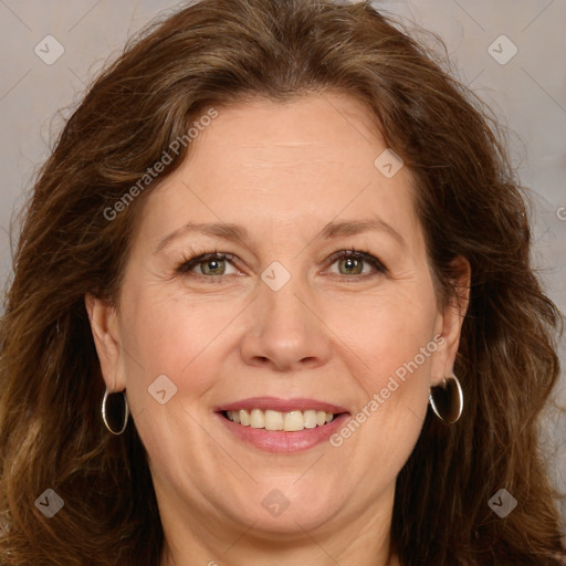 Joyful white adult female with long  brown hair and brown eyes