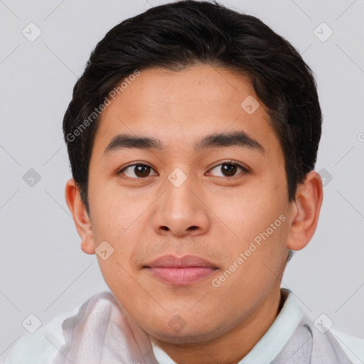 Joyful asian young-adult male with short  brown hair and brown eyes