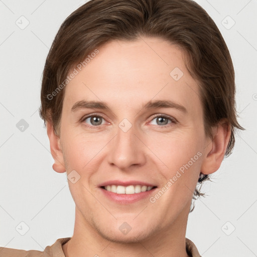 Joyful white young-adult female with short  brown hair and grey eyes