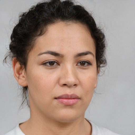 Neutral latino young-adult female with medium  brown hair and brown eyes