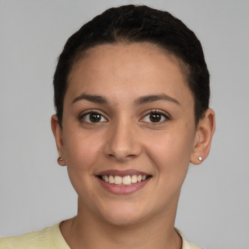 Joyful white young-adult female with short  brown hair and brown eyes