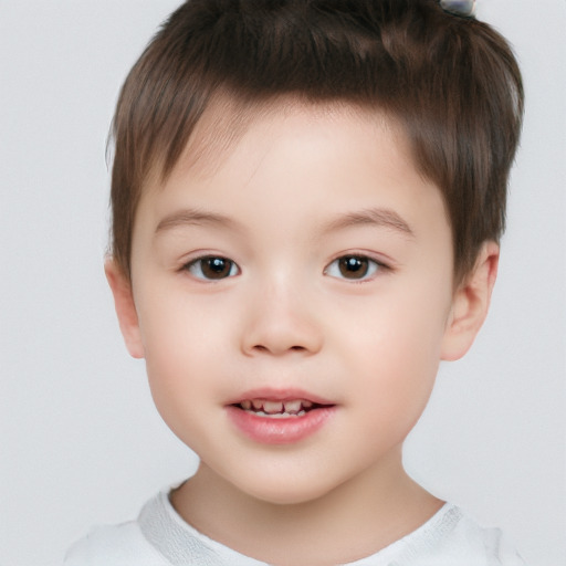 Joyful white child male with short  brown hair and brown eyes