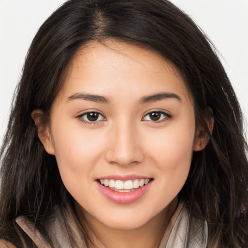 Joyful white young-adult female with long  brown hair and brown eyes