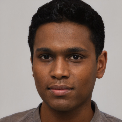 Neutral black young-adult male with short  black hair and brown eyes