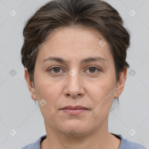 Joyful white adult female with short  brown hair and brown eyes